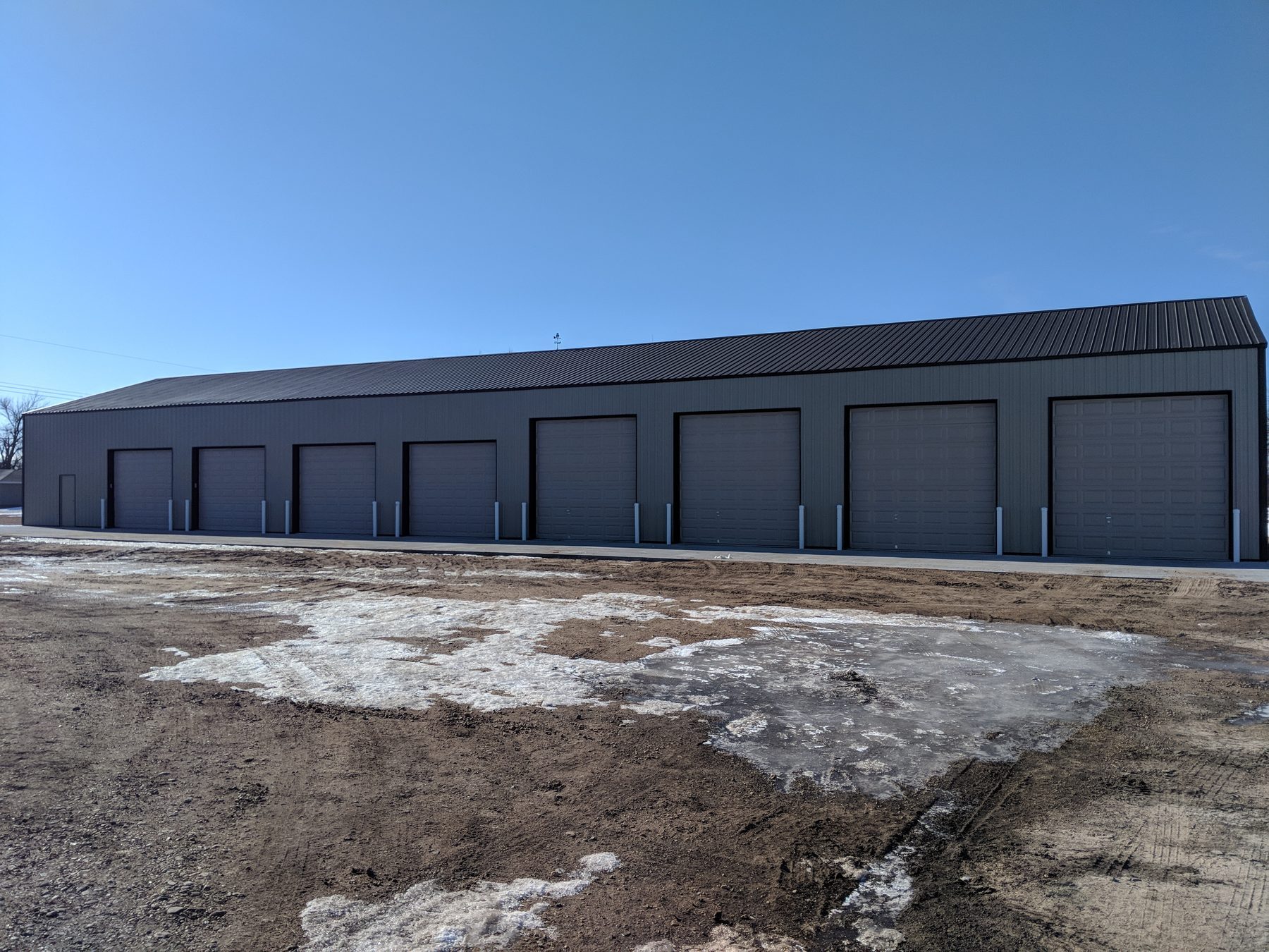 Large shop building with multiple overhead doors